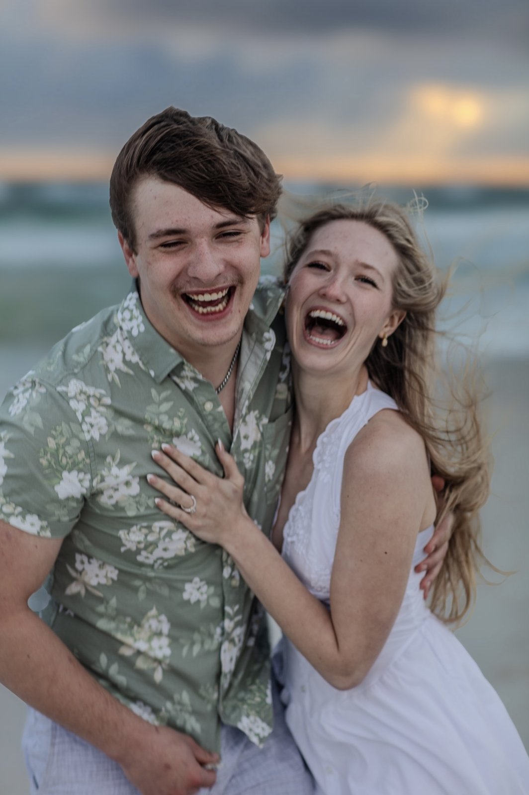 Laughing couple at sunset on the beach, Emerald Coast — Ed Gutentag