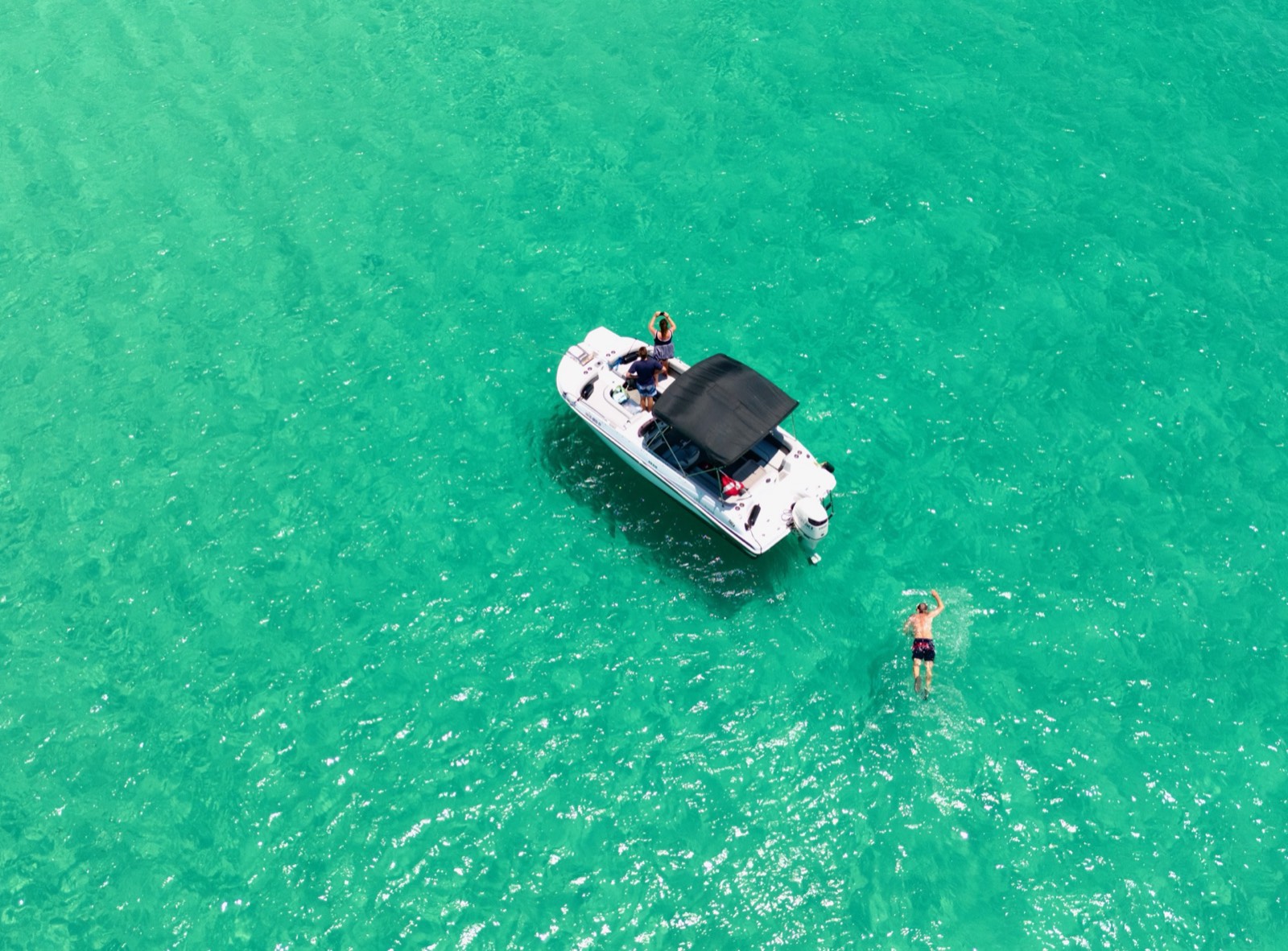 Aerial of a boat cutting through the Gulf, Emerald Coast