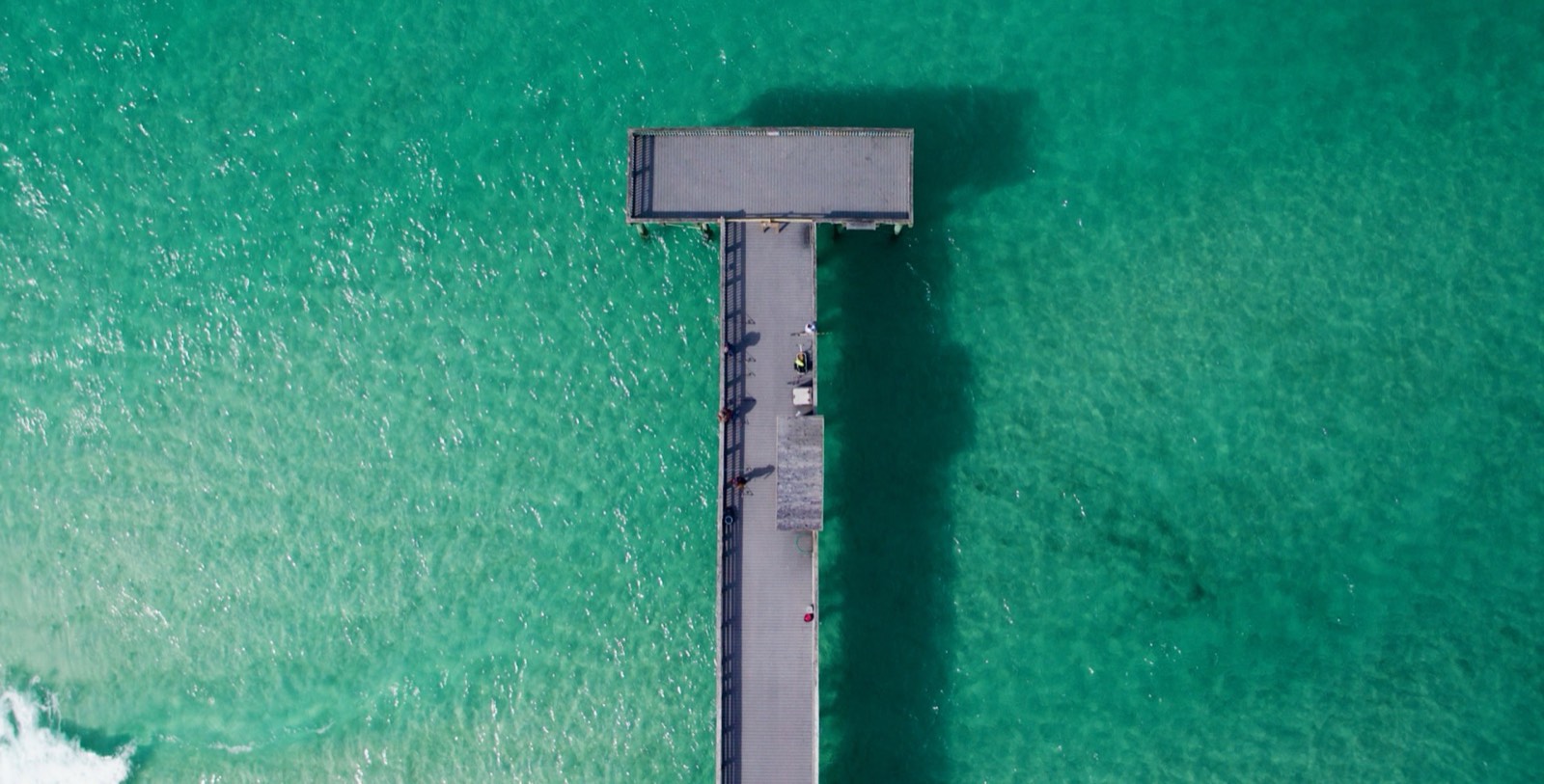 Overhead aerial of the pier and turquoise water, Emerald Coast