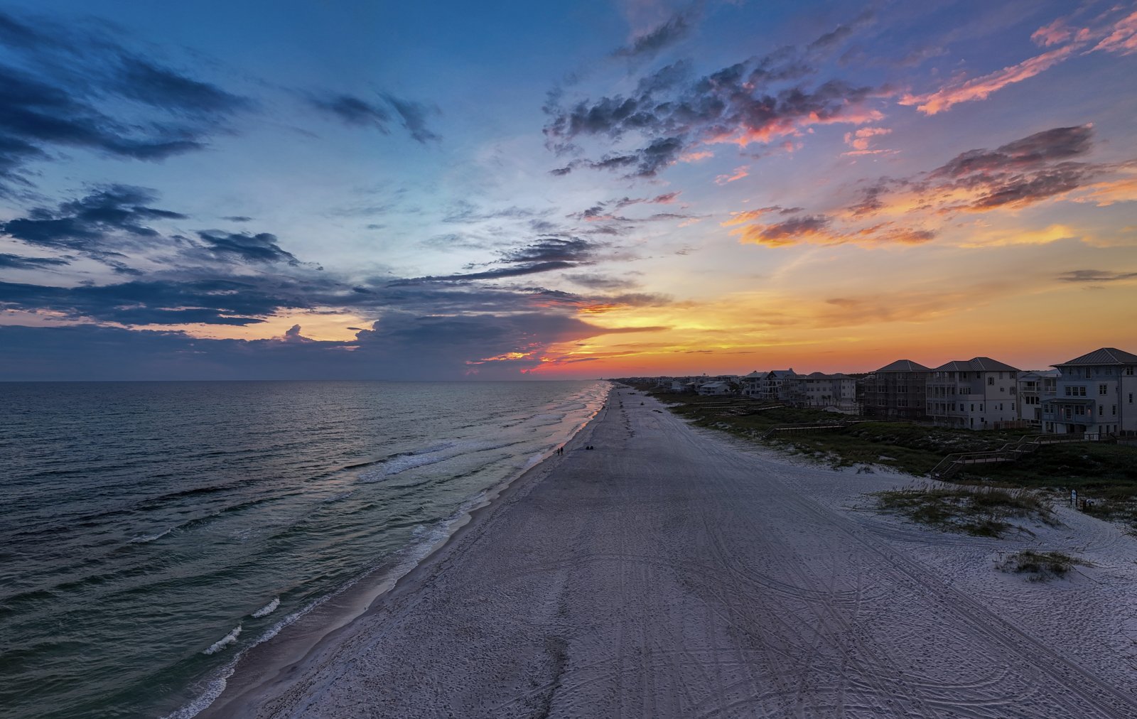 Aerial sunset over the Emerald Coast coastline — Ed Gutentag