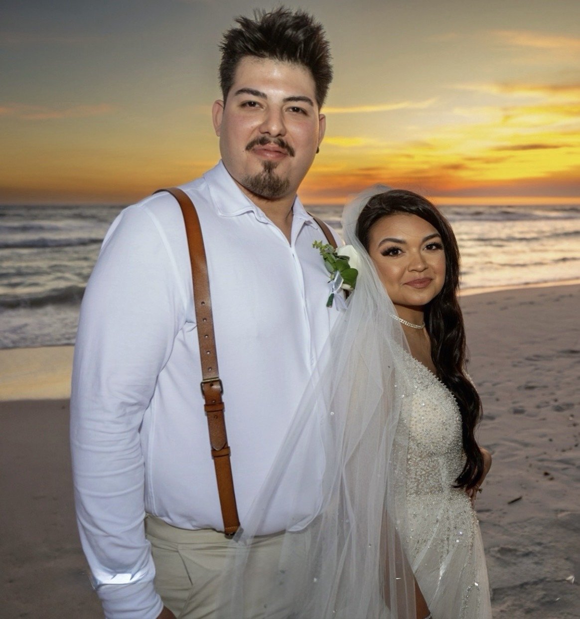 Wedding couple with flowing veil at sunset, Emerald Coast